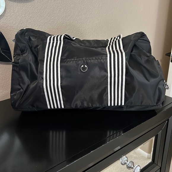 DSW Bags Navy Blue And White Striped Padded Duffle Front And Side